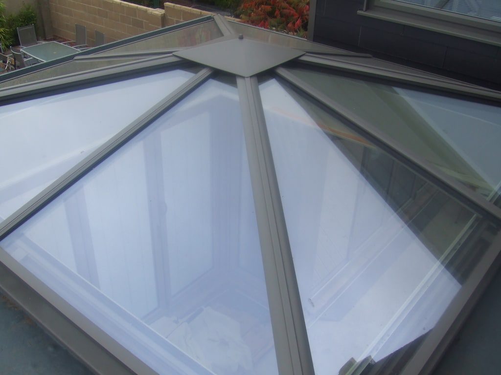 glass or solid conservatory roof