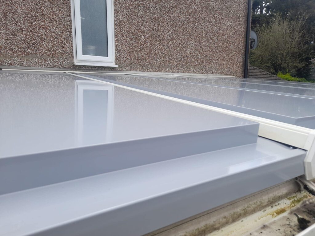 conservatory roof panels in a white finish to a house
